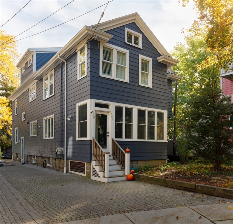 107 Grozier Road, Unit 1 Cambridge, MA 02138 - Photo 23 of 23 a front view of a house with a yard
