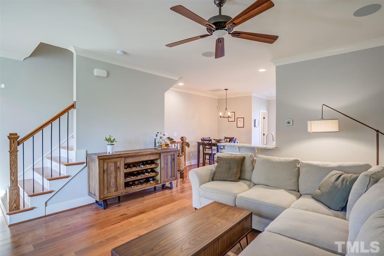 664 Watauga Street Raleigh, NC 27604 - Photo 22 of 30 a living room with furniture and a fireplace