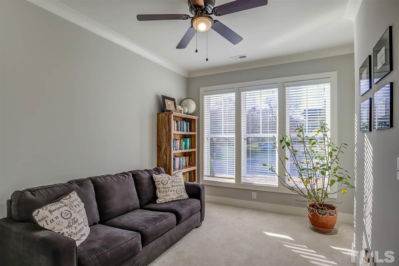 664 Watauga Street Raleigh, NC 27604 - Photo 7 of 30 a living room with furniture and a potted plant