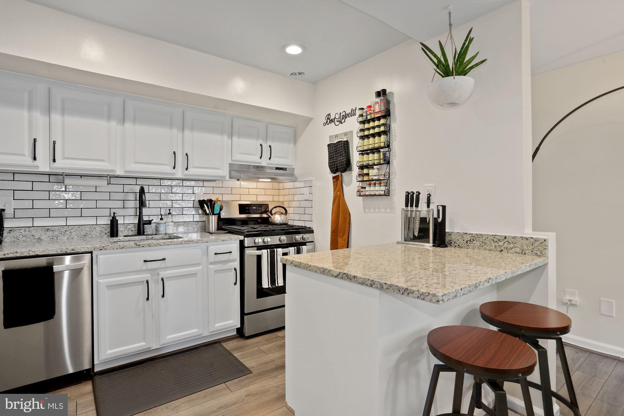 116 Haycock Road, Unit A2 Falls Church, VA 22046 - Photo 12 of 22 Kitchen With Breakfast Bar