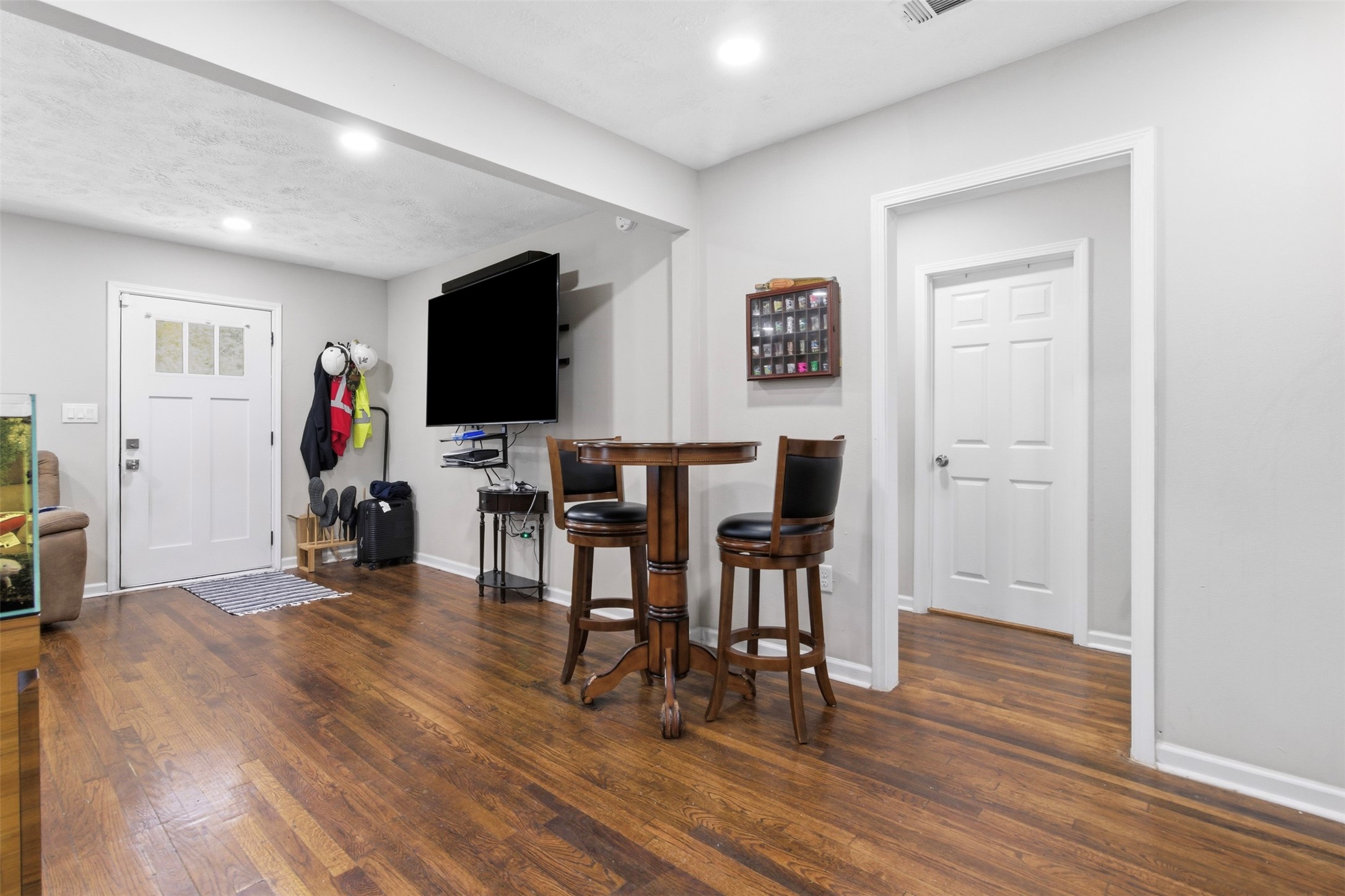 306 Center Street Pasadena, TX 77506 - Photo 10 of 31 a view of a dining room with furniture and wooden floor