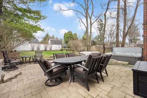 a view of a patio with a table and chairs
