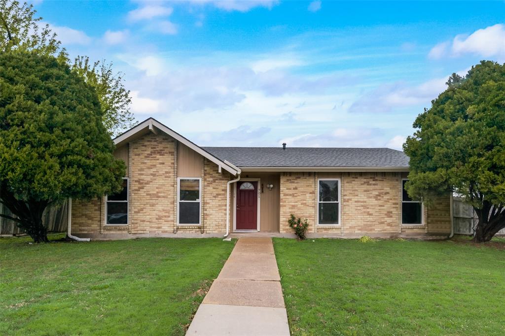 front view of a house with a yard