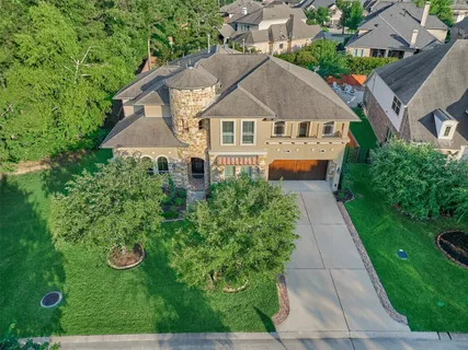 a aerial view of a house with a yard