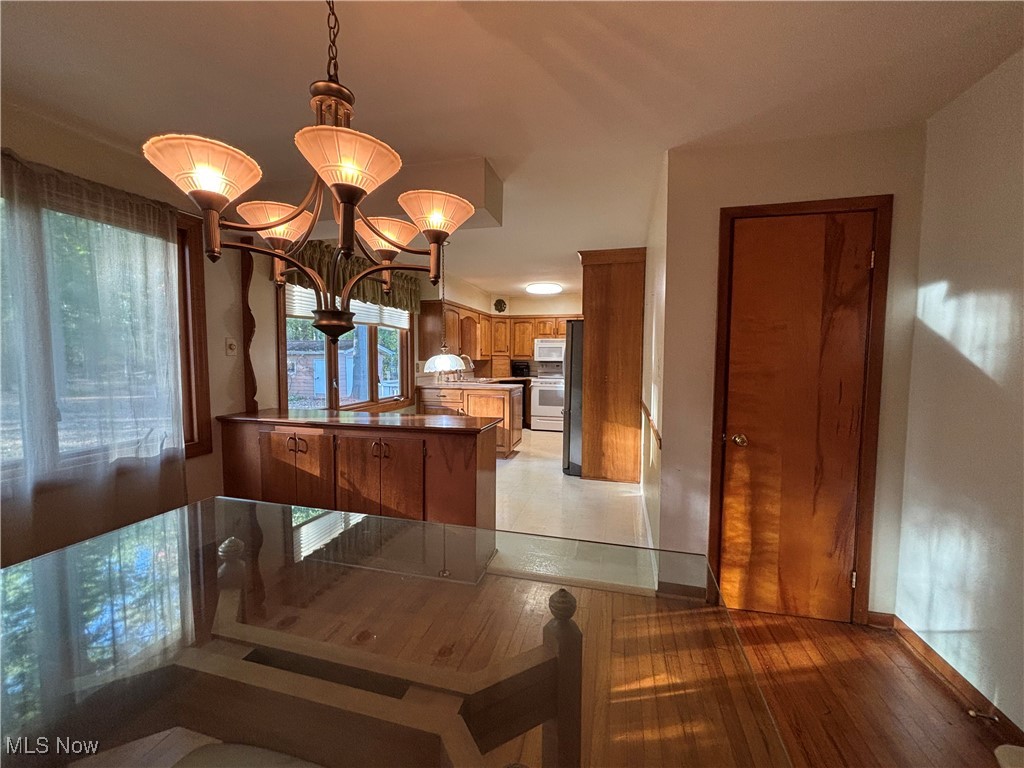 1900 Jaycox Road Avon, OH 44011 - Photo 9 of 26 Dining space with a chandelier and light wood finished floors