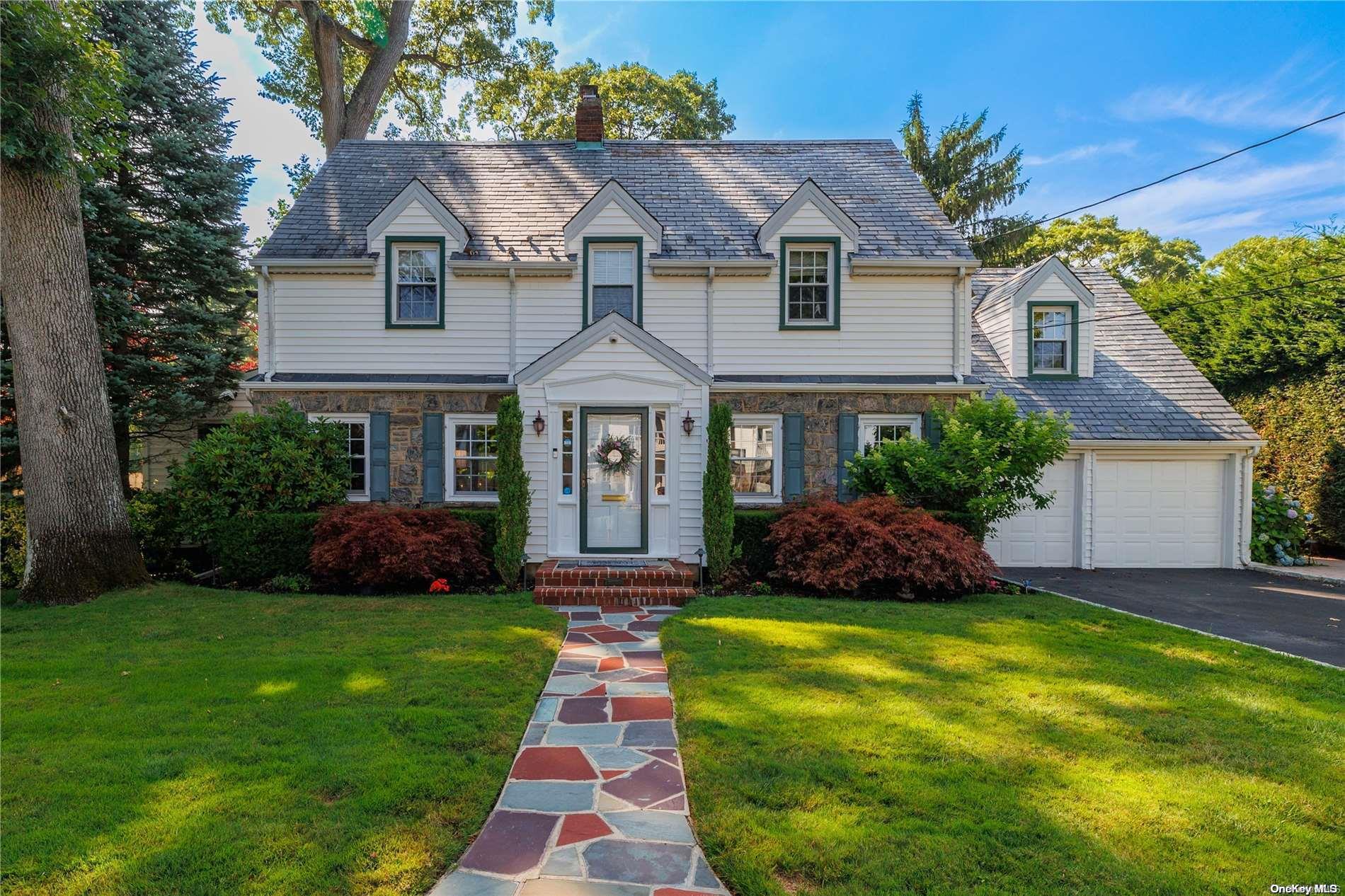 8 Nottingham Road Rockville Centre, NY 11570 - Photo 1 of 1 a front view of a house with a yard