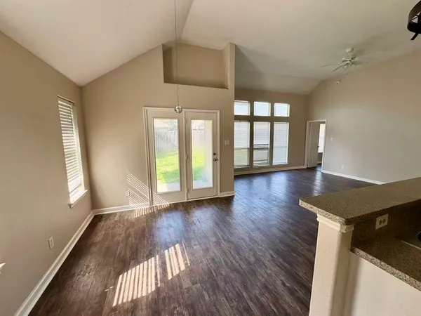 a kitchen with a sink appliances and cabinets