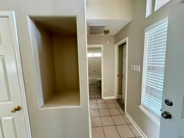 a view of a bathroom with a glass shower door