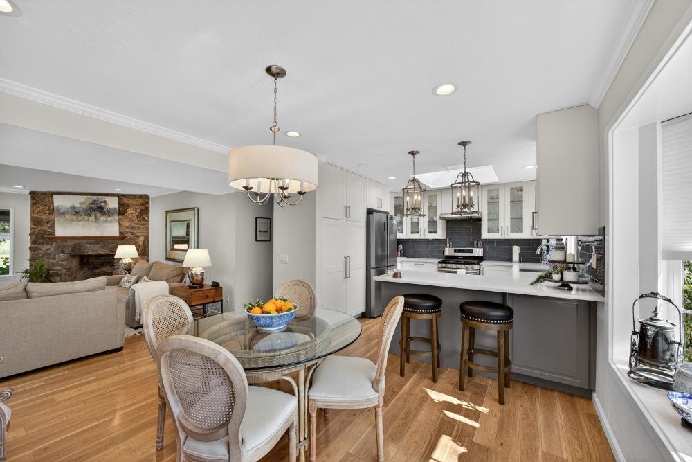 20690 County Road 79B Capay, CA 95607 - Photo 19 of 96 a view of a dining room and livingroom with furniture wooden floor a chandelier