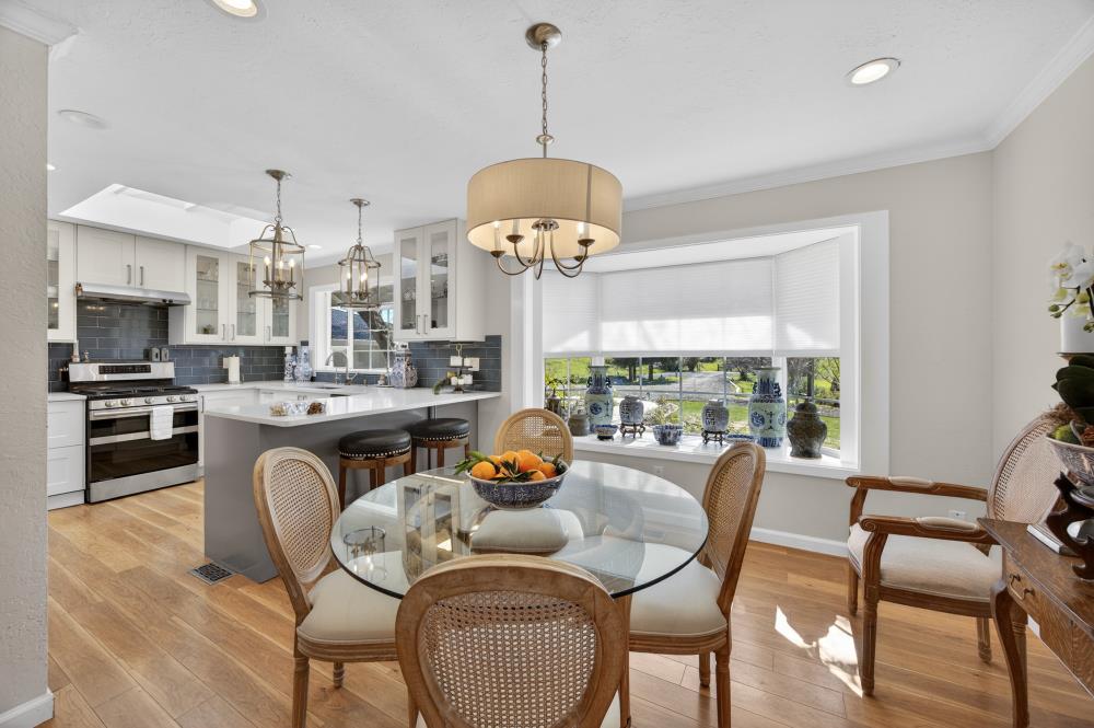 20690 County Road 79B Capay, CA 95607 - Photo 20 of 96 a dining room with furniture a chandelier and wooden floor