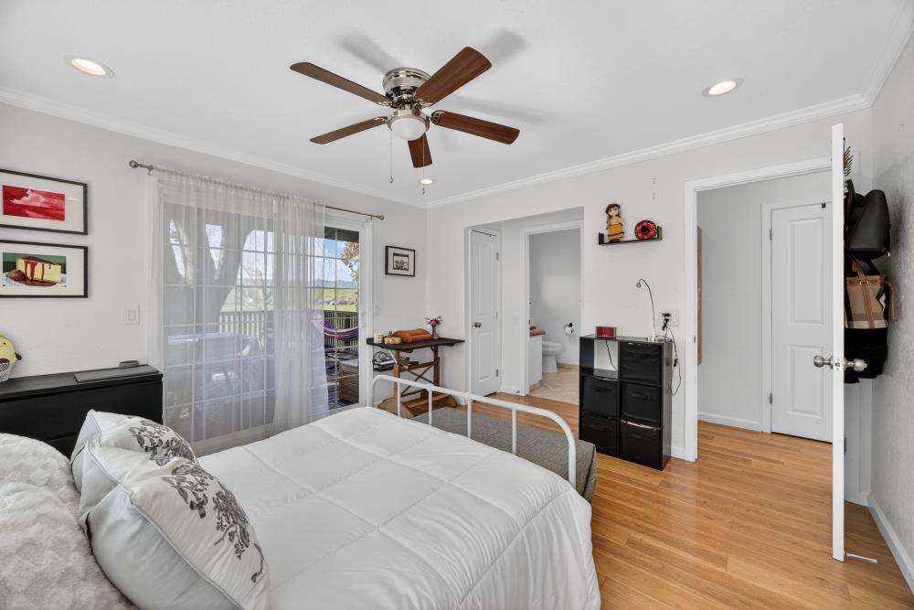 20690 County Road 79B Capay, CA 95607 - Photo 28 of 96 a bedroom with a bed and a chandelier