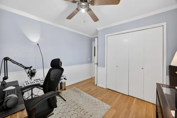 a very nice looking room with a large window and a rug