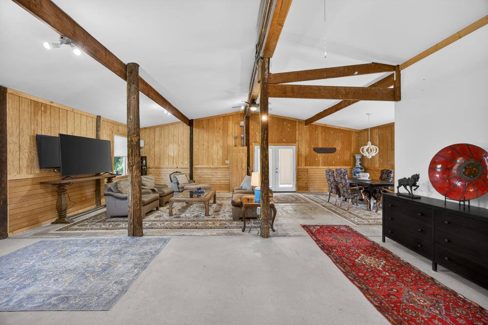 20690 County Road 79B Capay, CA 95607 - Photo 64 of 96 a living room with furniture a flat screen tv and large window