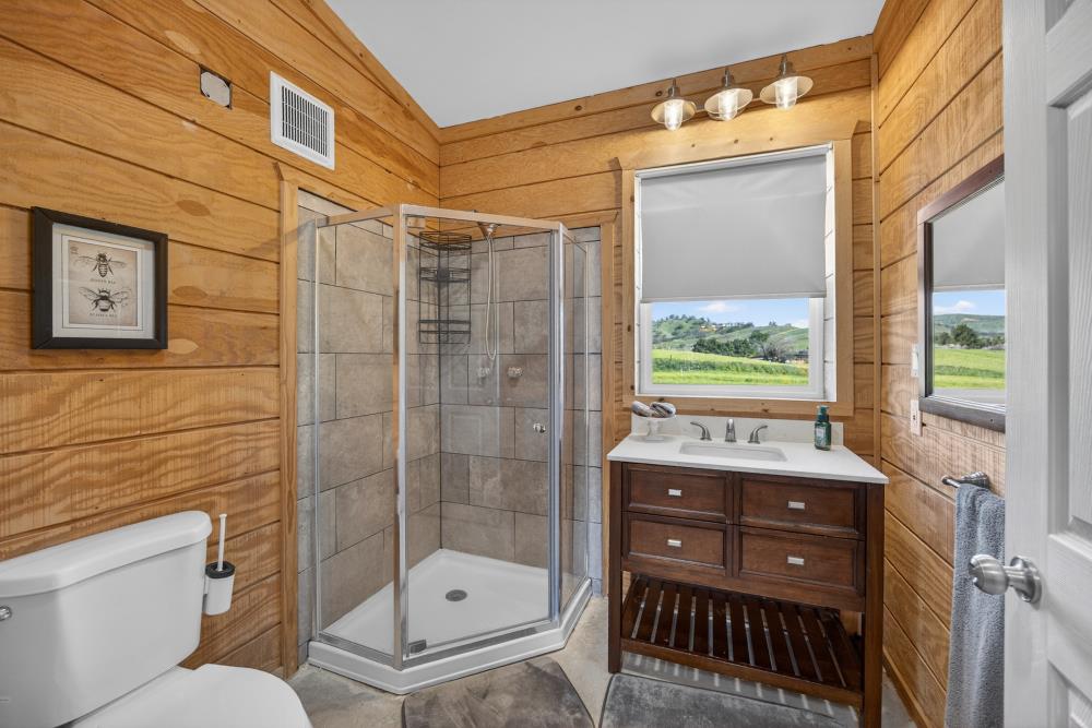 20690 County Road 79B Capay, CA 95607 - Photo 67 of 96 a bathroom with a toilet a sink and shower