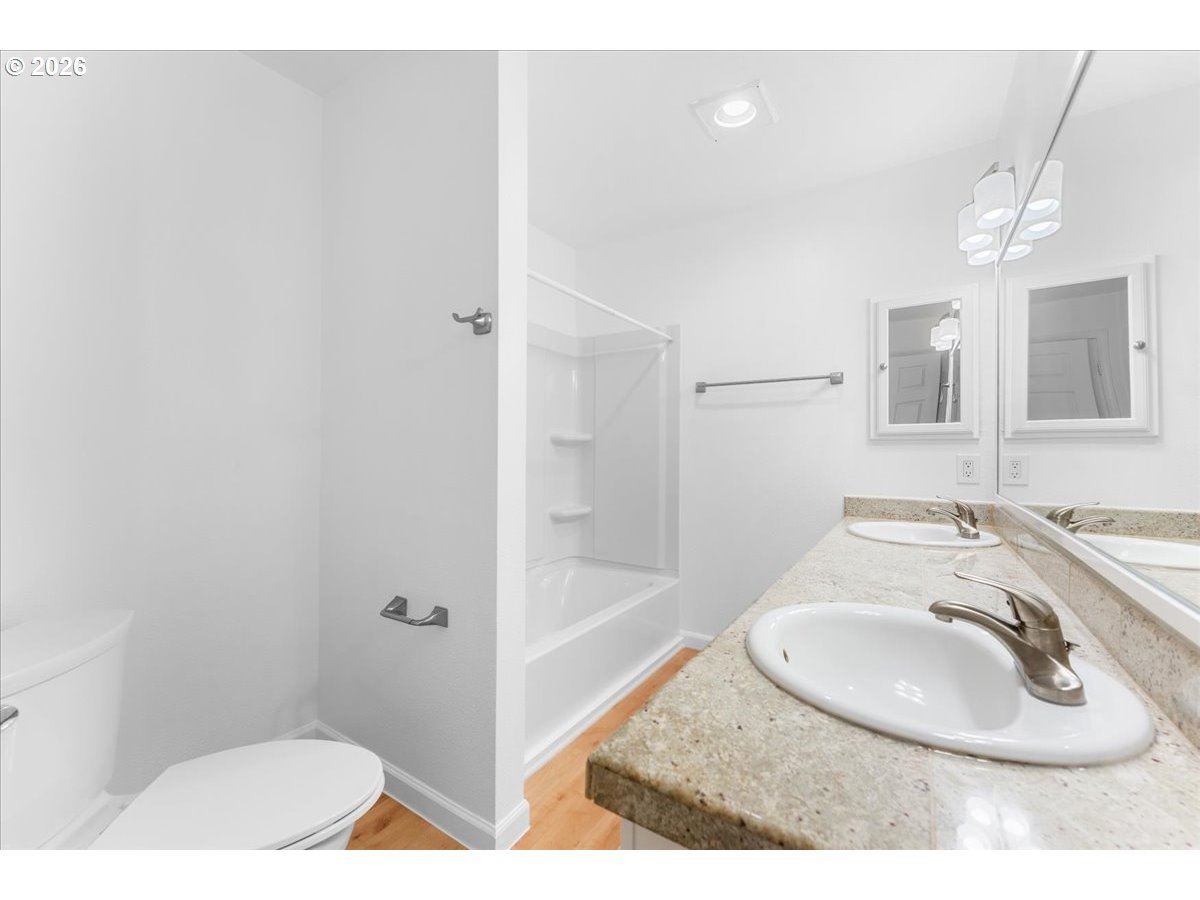 10160 Southeast Talbert Street Clackamas, OR 97015 - Photo 19 of 25 a bathroom with a sink and a mirror