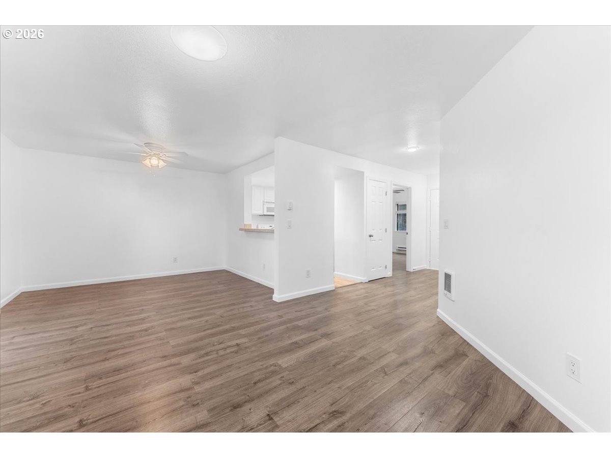 10160 Southeast Talbert Street Clackamas, OR 97015 - Photo 8 of 25 a view of empty room with wooden floor