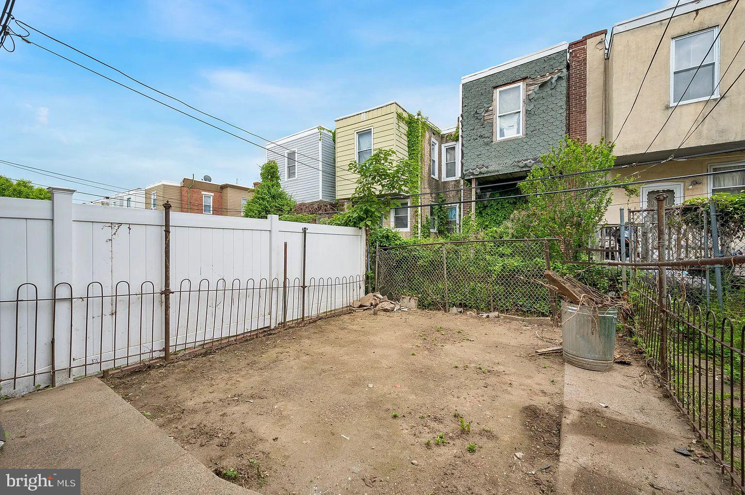 5625 Willows Avenue Philadelphia, PA 19143 - Photo 7 of 15 a view of a white house in front of a yard