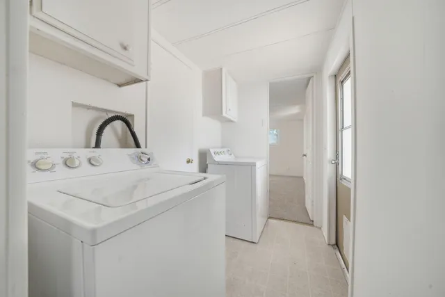 a bathroom with a tub sink shower and mirror