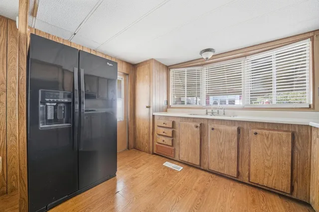 a kitchen sink sitting next to a window