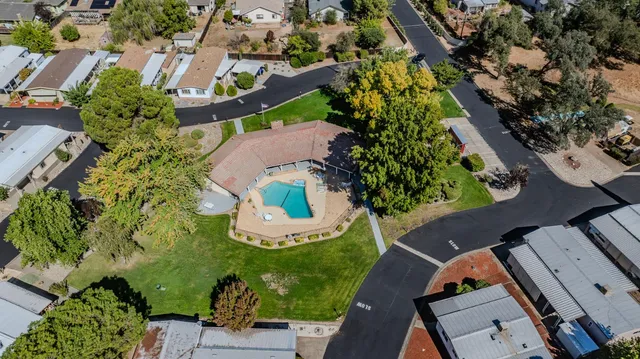 an aerial view of a house with a garden