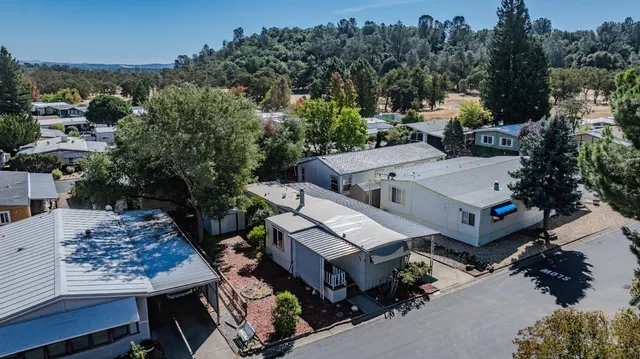 an aerial view of a house having yard