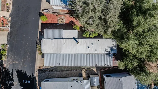 an aerial view of residential house with outdoor space and parking