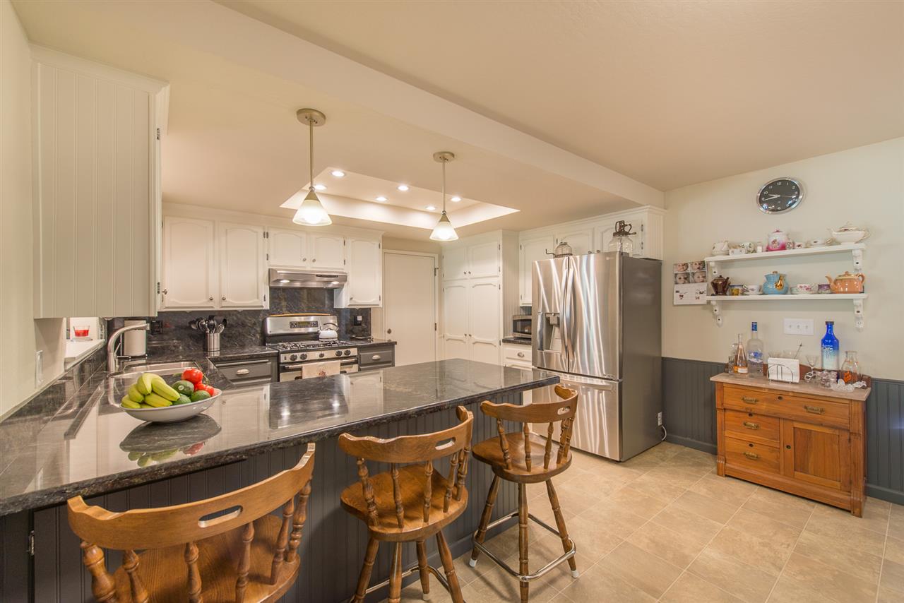 11202 Bishop Pine Road Truckee, CA 96161 - Photo 11 of 21 a kitchen with refrigerator and cabinets