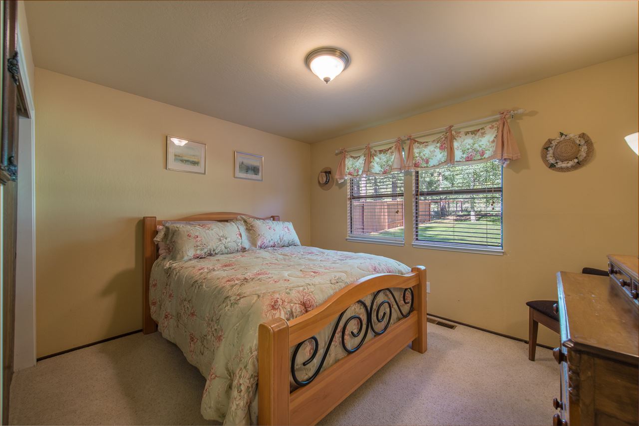 11202 Bishop Pine Road Truckee, CA 96161 - Photo 19 of 21 a bed sitting in a bedroom next to a window