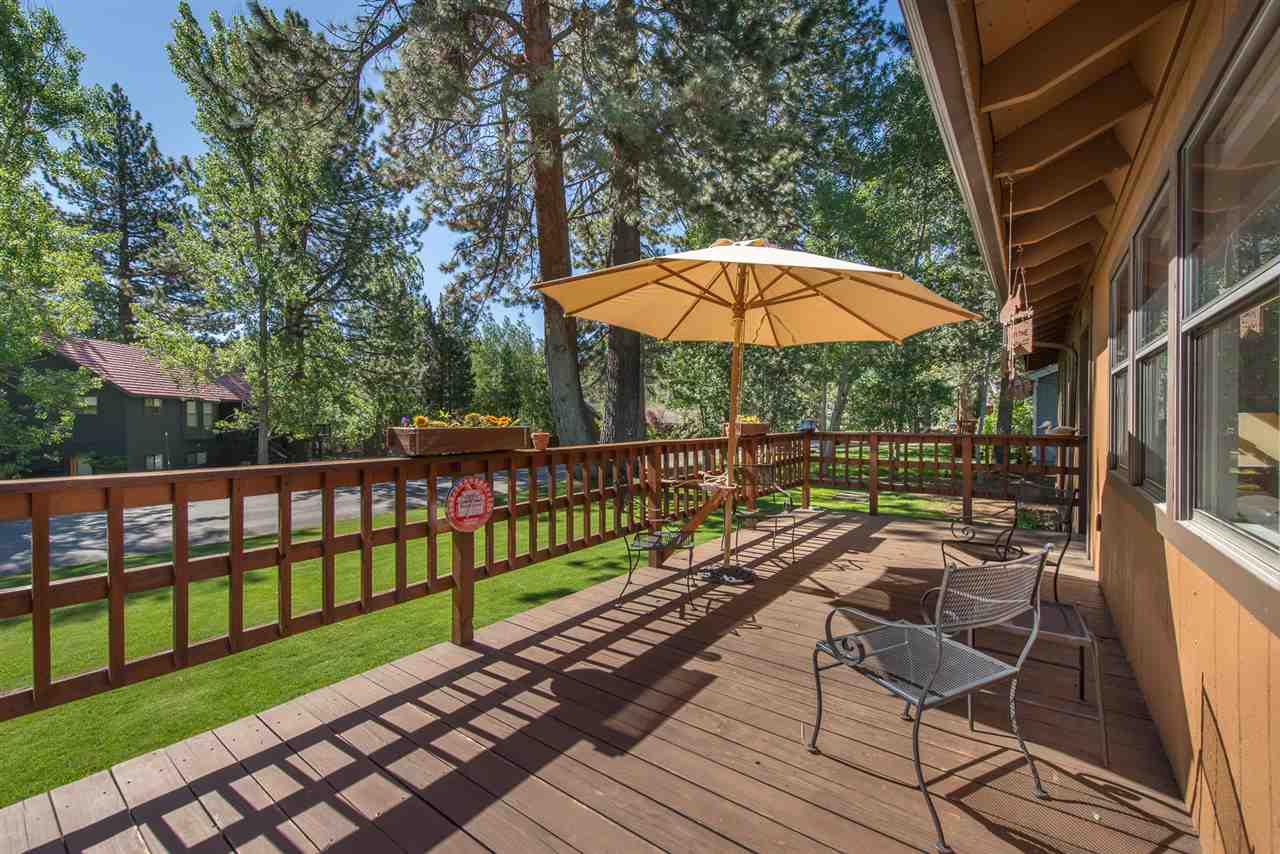11202 Bishop Pine Road Truckee, CA 96161 - Photo 21 of 21 a view of a balcony with wooden floor and umbrella
