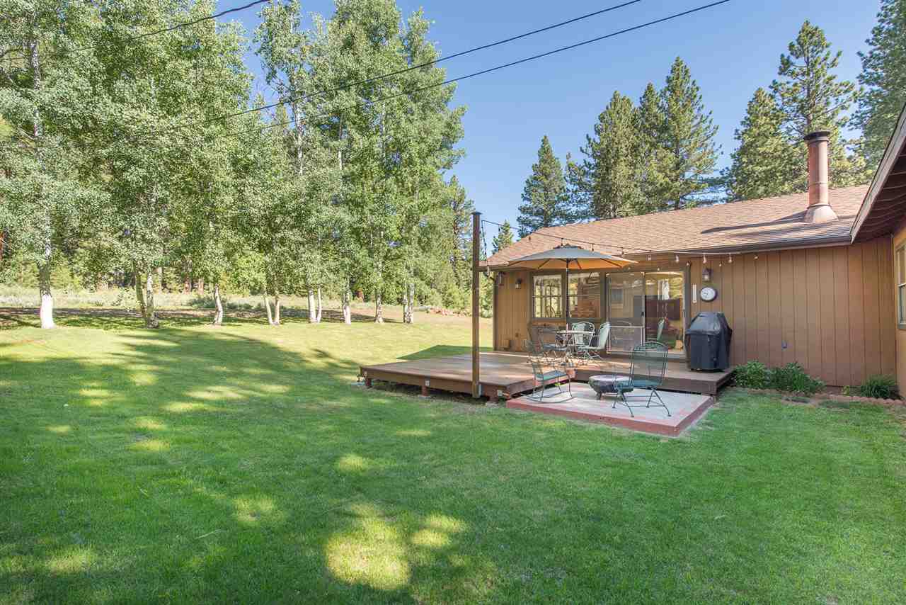 11202 Bishop Pine Road Truckee, CA 96161 - Photo 4 of 21 a patio with table and chairs and a big yard