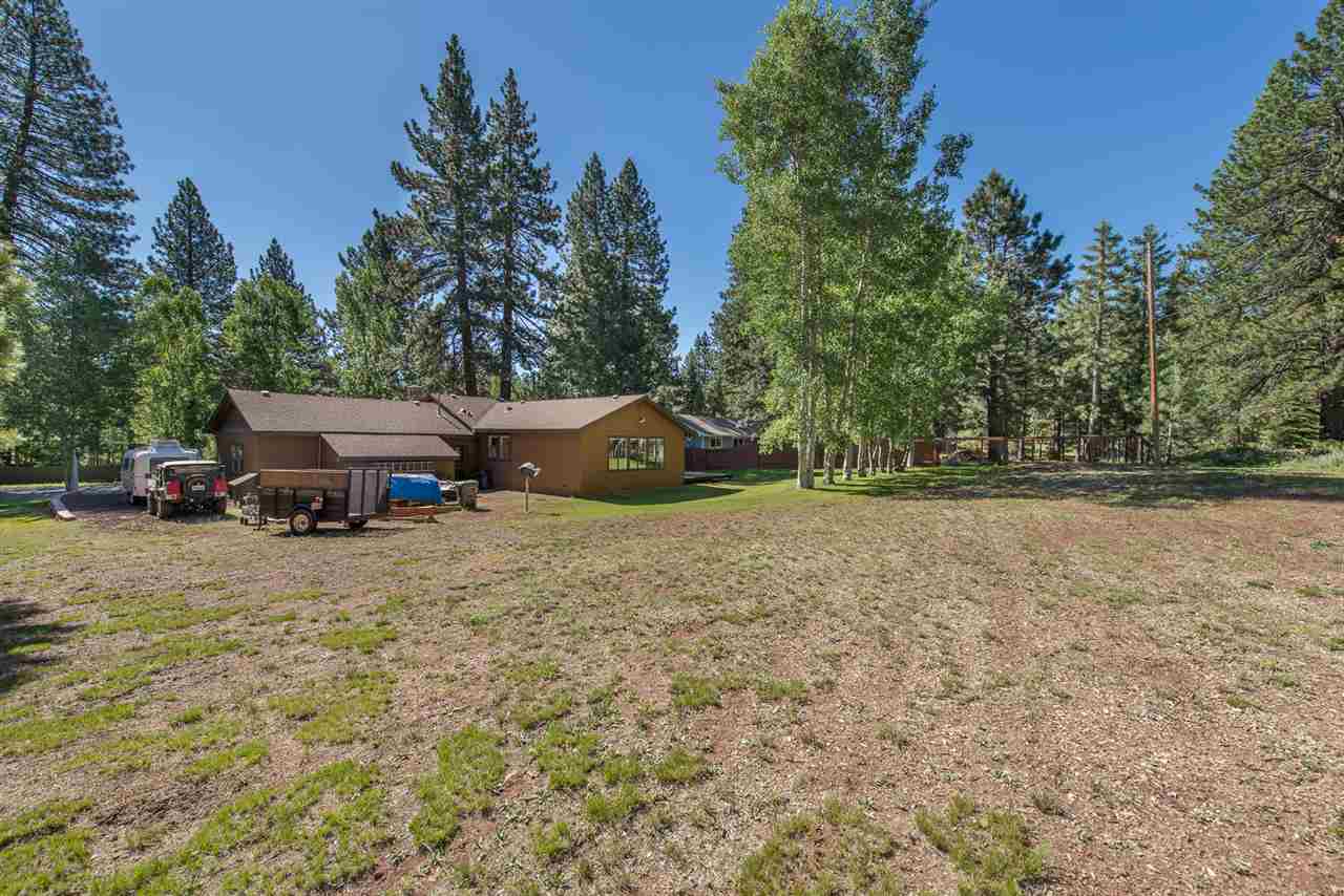 11202 Bishop Pine Road Truckee, CA 96161 - Photo 5 of 21 a backyard of a house with lots of green space and fountain