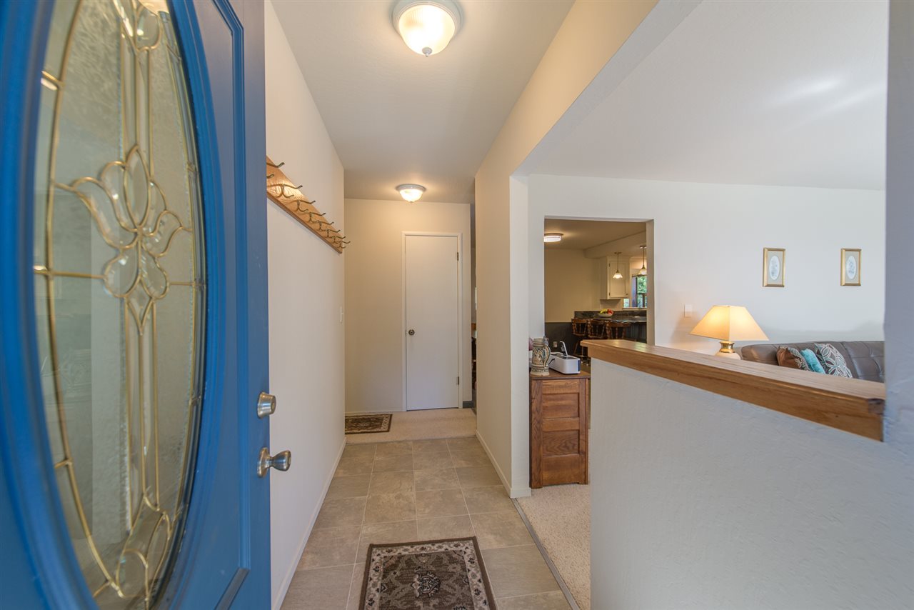 11202 Bishop Pine Road Truckee, CA 96161 - Photo 6 of 21 a view of a hallway and a livingroom with furniture