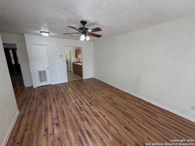 202 Ash Drive, Unit 104 Converse, TX 78109 - Photo 3 of 10 a view of empty room with wooden floor and ceiling fan