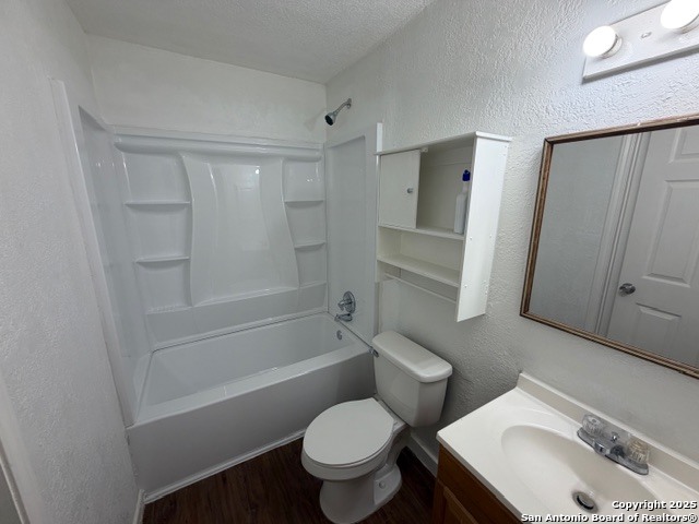 202 Ash Drive, Unit 104 Converse, TX 78109 - Photo 7 of 10 a bathroom with a sink toilet and shower