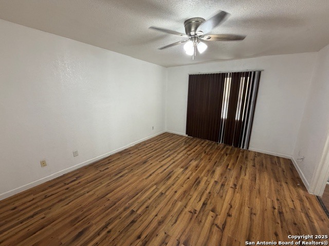 202 Ash Drive, Unit 104 Converse, TX 78109 - Photo 8 of 10 a view of a room with wooden floor