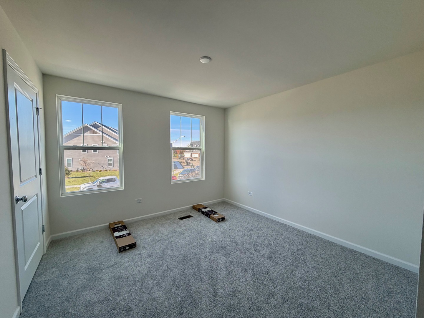 704 Switchgrass Way Bolingbrook, IL 60490 - Photo 11 of 14 an empty room with windows