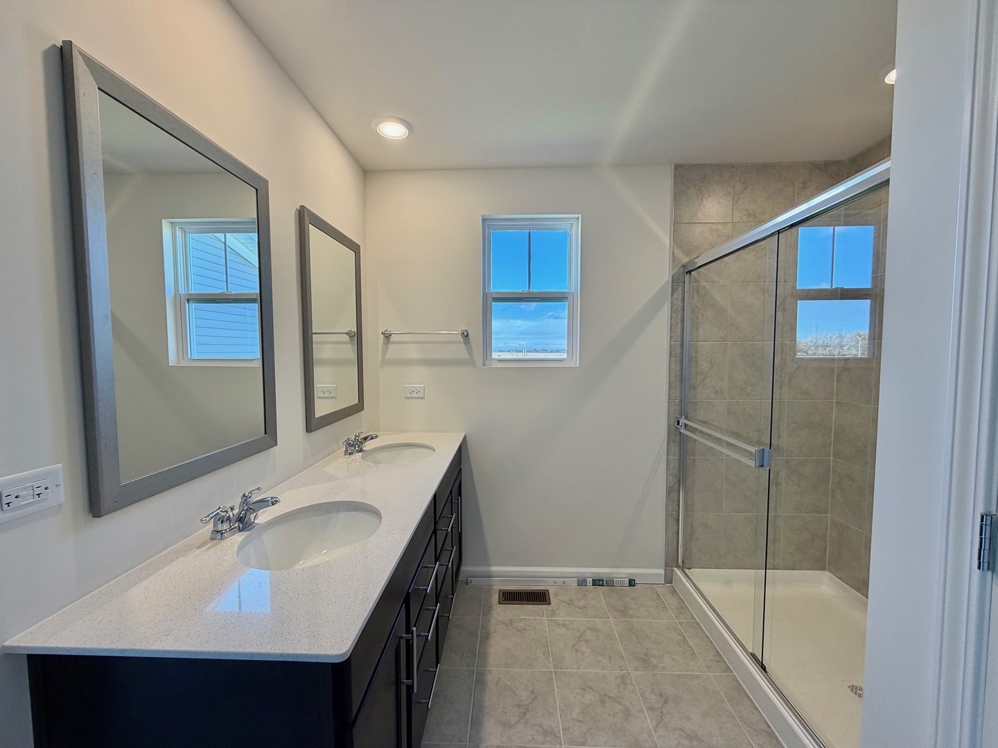704 Switchgrass Way Bolingbrook, IL 60490 - Photo 9 of 14 a bathroom with a sink and a mirror