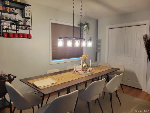 a view of a dining room with furniture and window