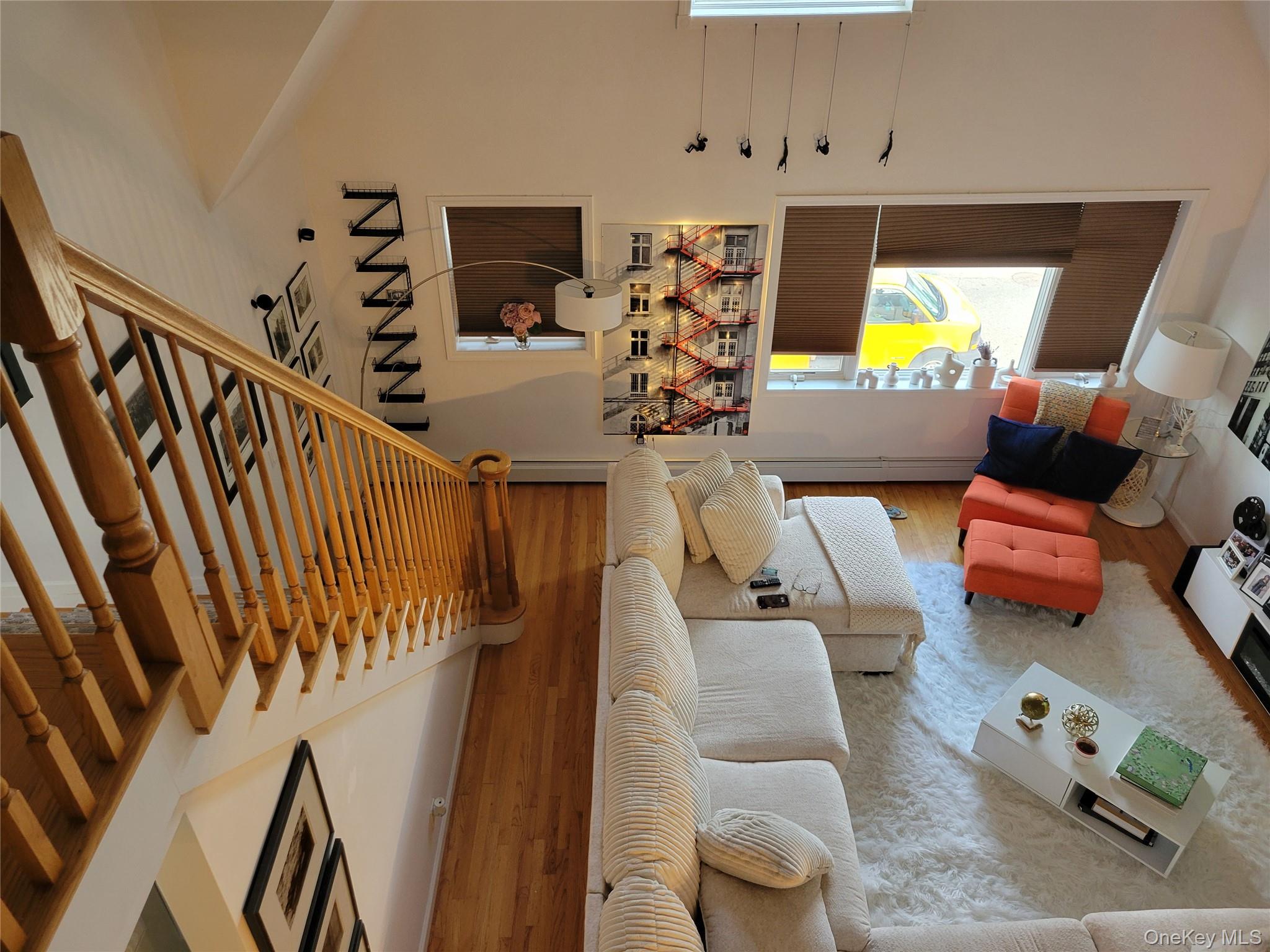 61-40 173rd Street Queens, NY 11365 - Photo 9 of 9 a living room with furniture and a flat screen tv
