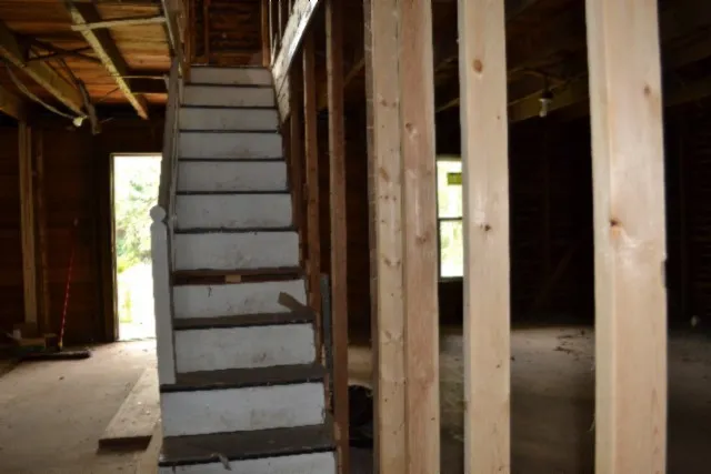 a view of a porch with a door and outside view