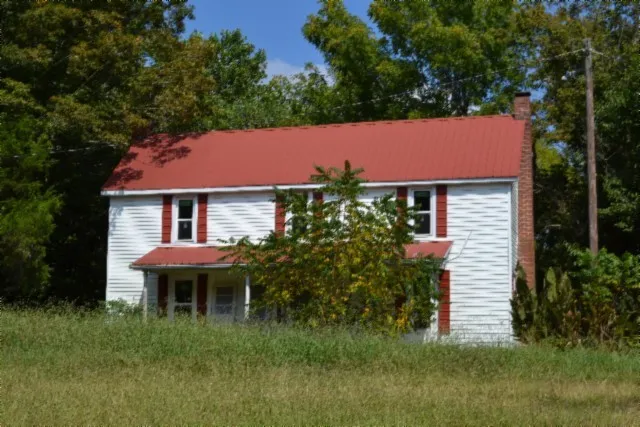 a view of a house with a tree