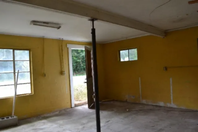 a backyard of a house with lots of green space