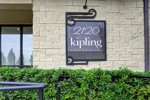 a sign that is on a brick wall