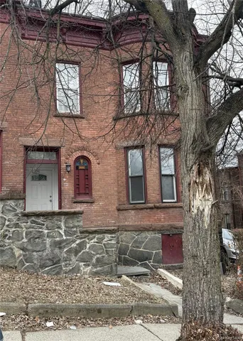 a front view of a house with parking