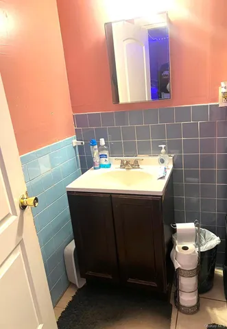 a bathroom with a bathtub and shower