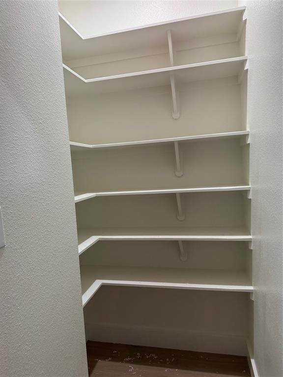 143 Ridge Road Tuscola, TX 79562 - Photo 8 of 24 a view of walk in closet with empty racks
