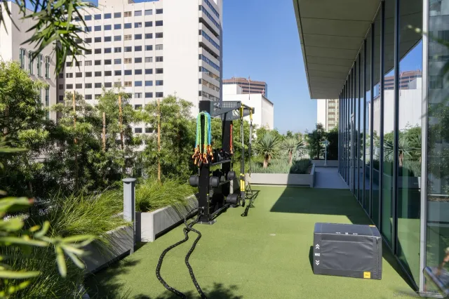 a view of a chairs and table in the balcony