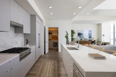 a living room with furniture and large windows