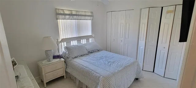a room that has a bed and a window in it