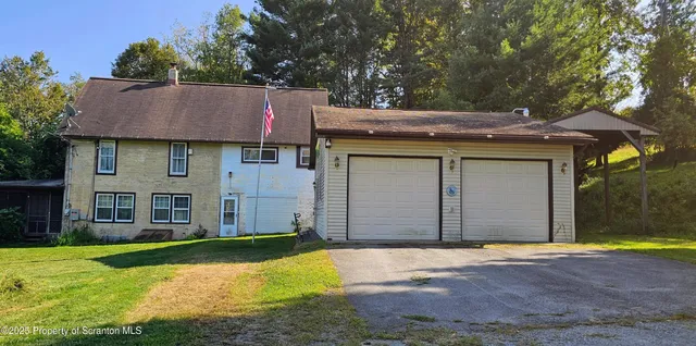 a front view of a house with yard